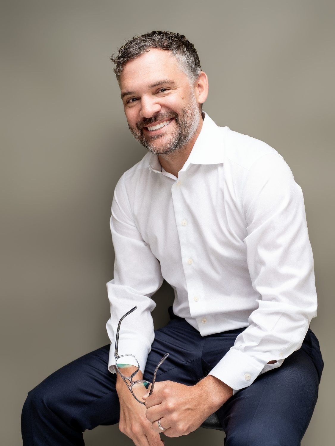 Corporate headshot of a financial advisor in a suit