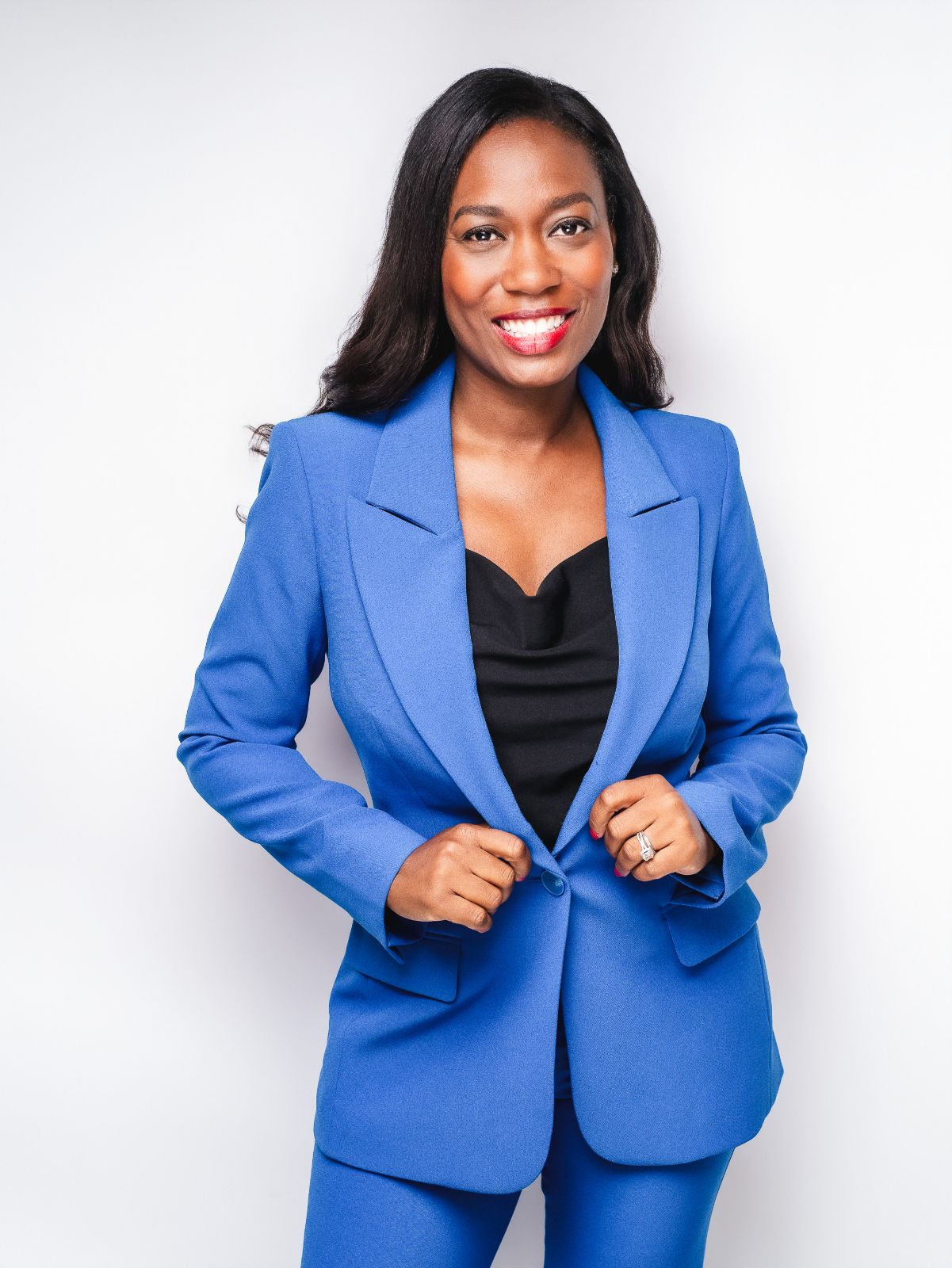 Professional branding headshot of a woman in a blue suit, photographed in Princeton, New Jersey