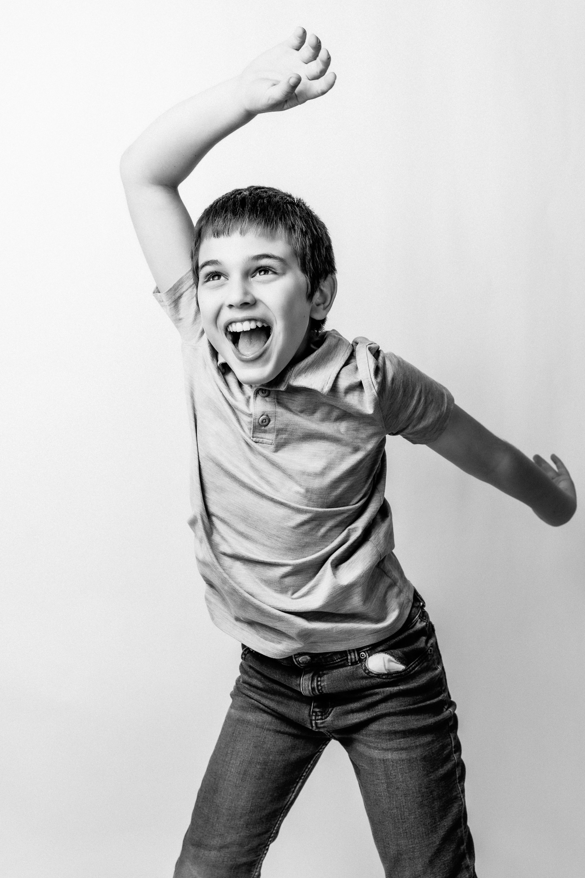 Teenager mid-jump during a studio portrait session