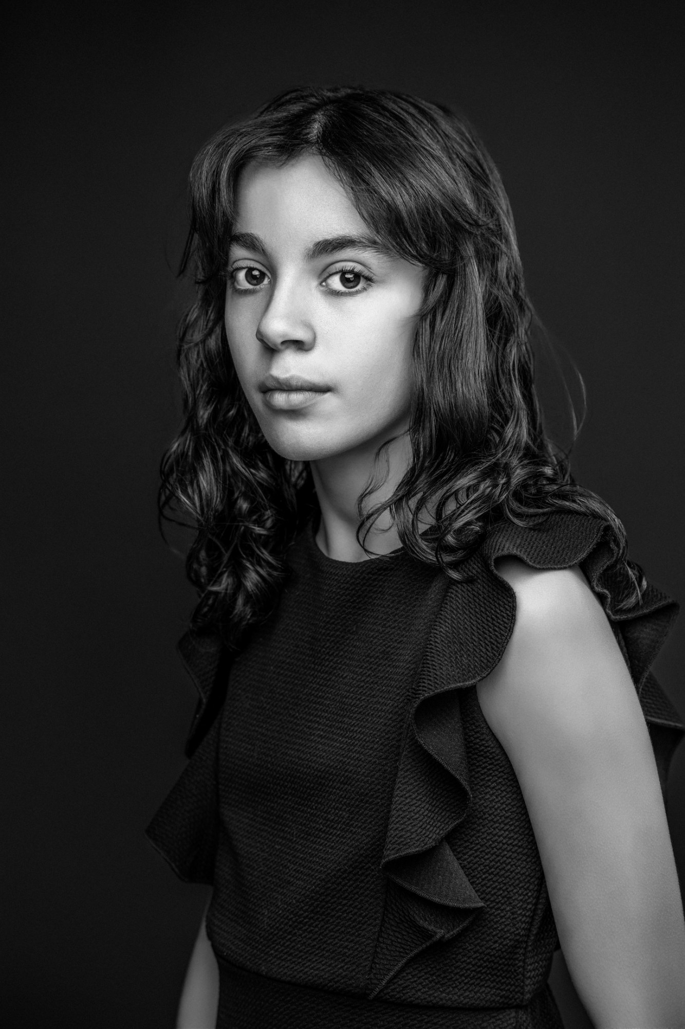 Studio portrait of a young girl on a dark background, Princeton NJ