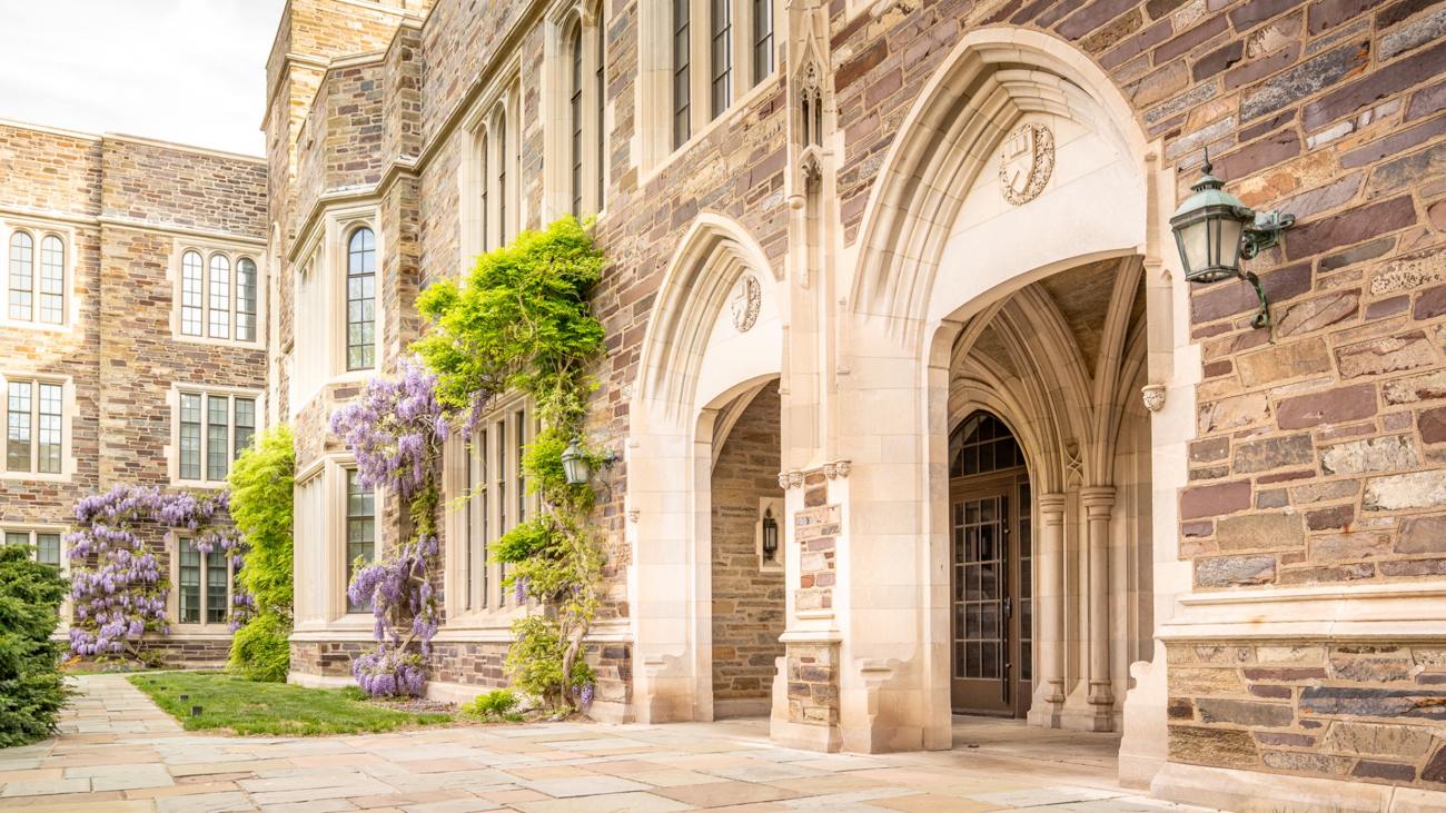 Collegiate Gothic archway on the Princeton University campus in spring